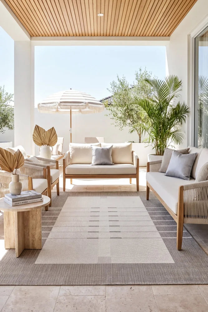 Samba Beige Cream Outdoor Rug — styled outdoor setting