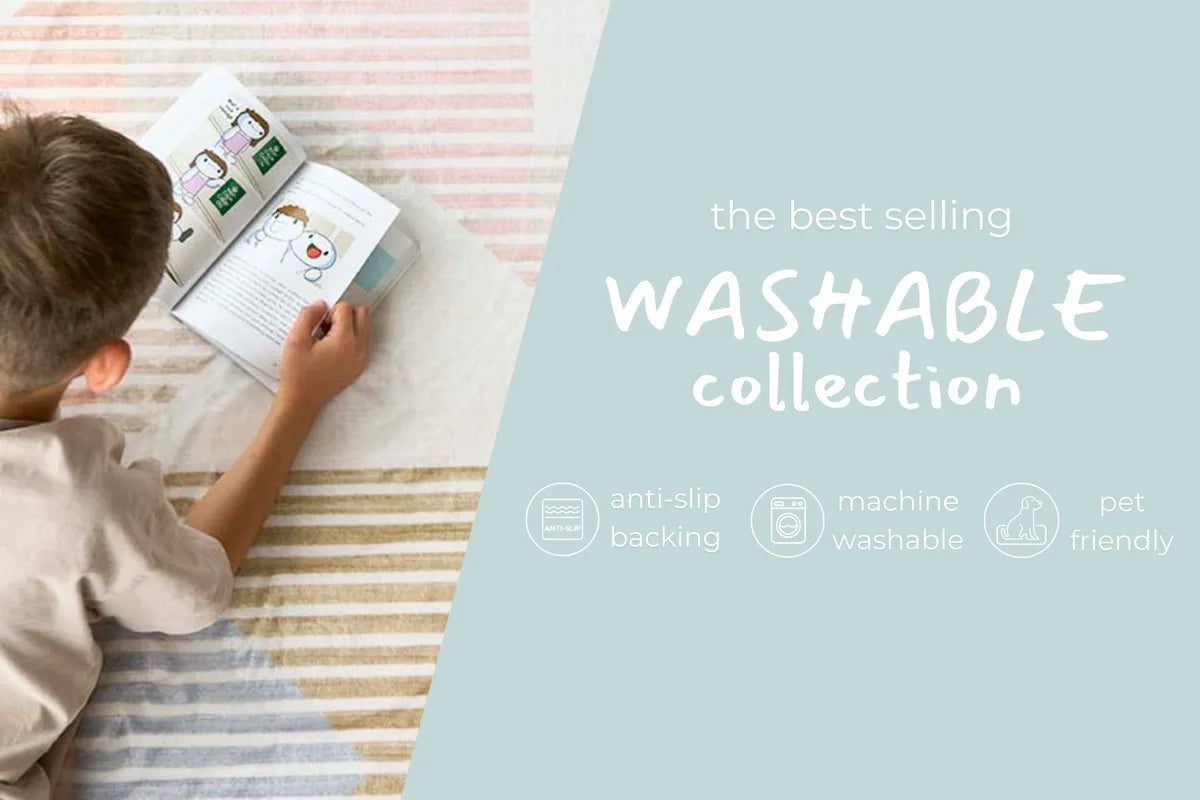 Young child reading on a striped washable rug from the machine-washable, anti-slip and pet-friendly collection