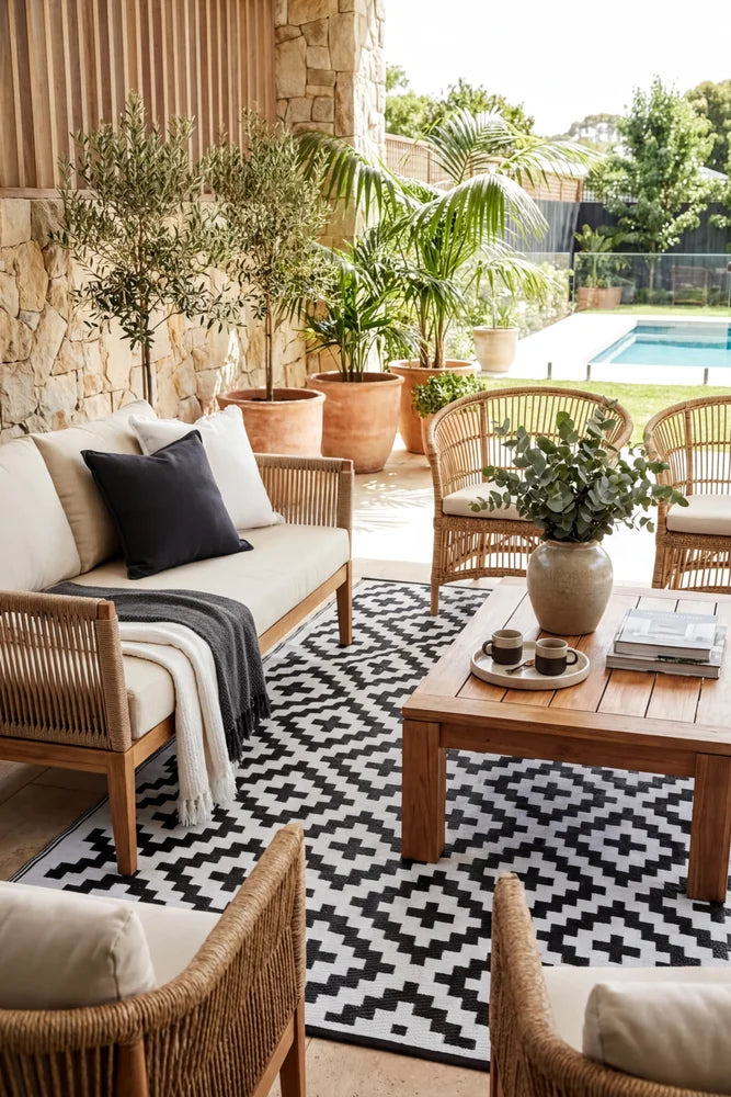 Aztec Black & White Foldable Outdoor Rug — styled outdoor setting