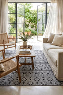 Alaska Indoor Outdoor 33 Dark Grey Rug — styled indoor setting