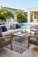 Alaska Indoor Outdoor 33 Brown Rug — styled outdoor setting