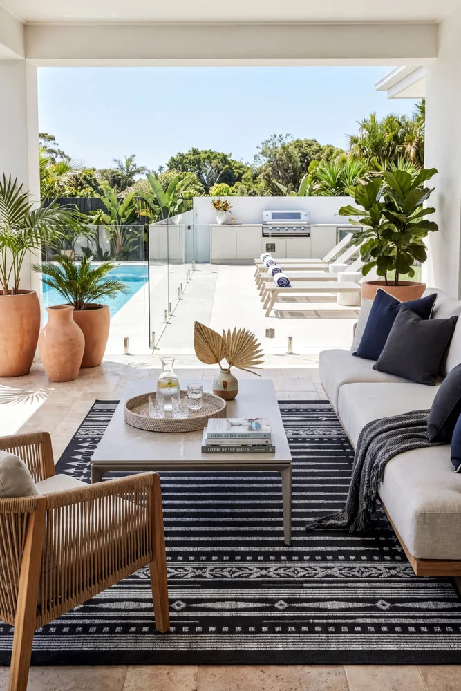 Alaska Indoor Outdoor 09 Dark Grey Rug — styled outdoor setting