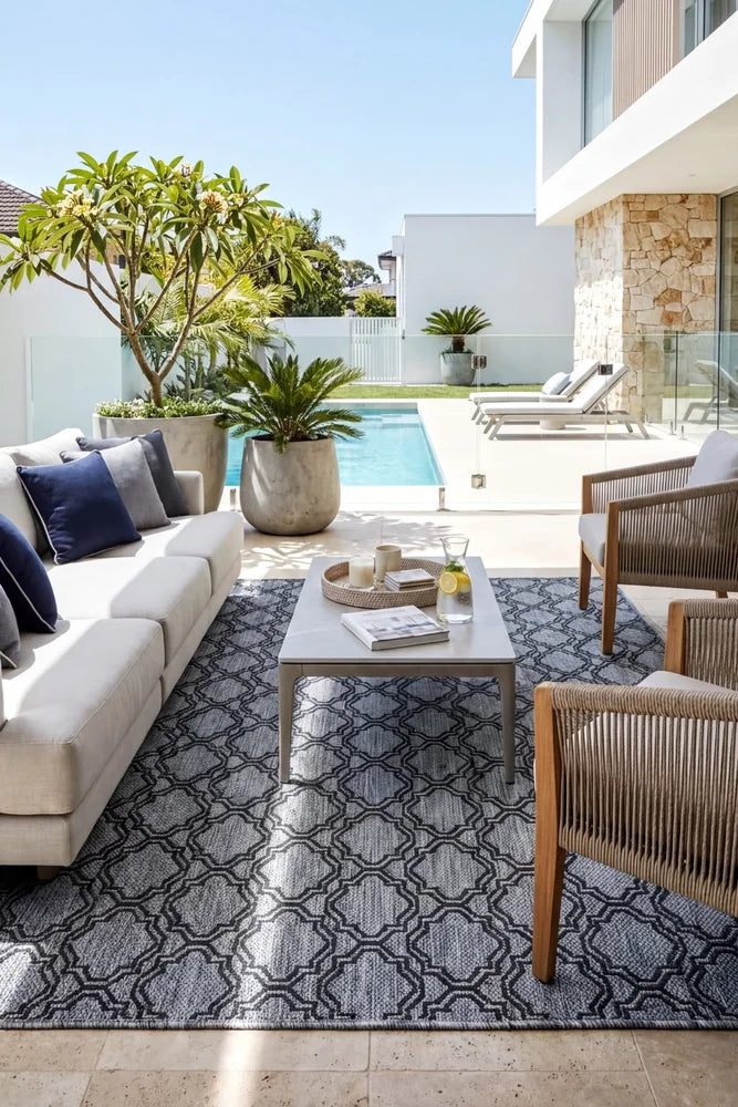 Alaska Indoor Outdoor 92 Grey Rug — styled outdoor setting