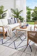 Mirada Cream Blue Outdoor Rug — styled indoor setting
