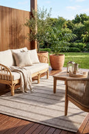 Summer 56 Beige Outdoor Rug — styled outdoor setting