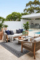 Alaska Indoor Outdoor 81 Grey Rug — styled outdoor setting