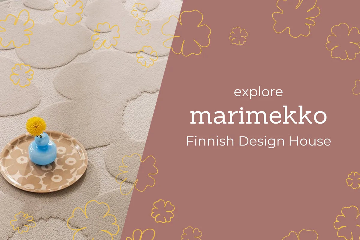 Cream Marimekko Unikko floral wool rug styled with a blue vase, from Finnish design house Marimekko