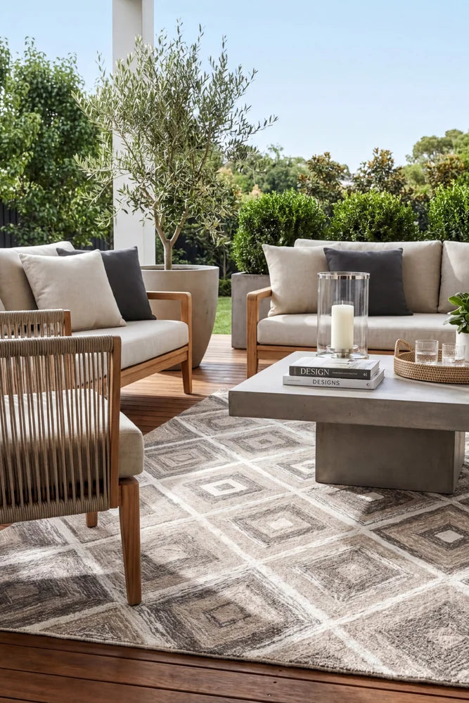 Alexandria Beige Indoor Outdoor Rug — styled outdoor setting