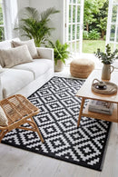 Aztec Black & White Foldable Outdoor Rug — styled indoor setting