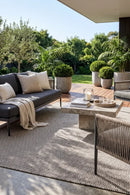 Bekal Ash Grey Indoor Outdoor Rug — styled outdoor setting