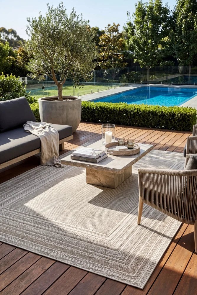 Colorado Lines Beige Outdoor Rug — styled outdoor setting