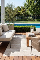 Colorado Waves Beige Outdoor Rug — styled outdoor setting