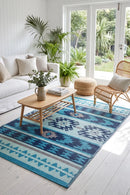 Cusco Blue Reversible Outdoor Rug — styled indoor setting