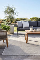Nevada 508  Indoor Outdoor Beige Rug — styled outdoor setting