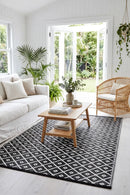 Kimberley Black Reversible Outdoor Rug — styled indoor setting