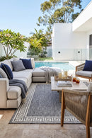 Alaska Indoor Outdoor 81 Light Grey Rug — styled outdoor setting