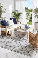 Mirada White Blue Outdoor Rug — styled outdoor setting