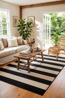 Nyoma Black Outdoor Rug — styled indoor setting