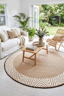 Olympia Beige Round Outdoor Rug — styled indoor setting