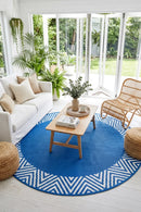 Olympia Blue Reversible Round Outdoor Rug — styled indoor setting