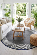 Olympia Grey Round Reversible Outdoor Rug — styled indoor setting