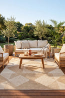 Patio Rico Natural Indoor Outdoor Rug — styled outdoor setting