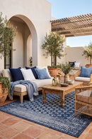 Pearl Blue Outdoor Rug — styled outdoor setting