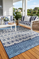 Seaside 3333 White Blue Rug — styled outdoor setting