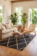 Tucson Black Outdoor Rug — styled indoor setting
